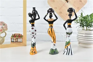 Three African tribal woman resin statues with colorful ethnic patterns for home decor