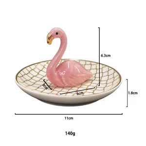 Detailed view of flamingo ceramic jewelry tray with gold grid pattern and dimensions