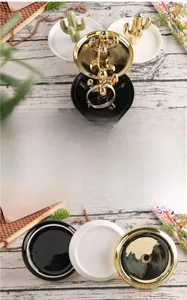 Macro detail of glossy ceramic cactus jewelry tray with gold finish and smooth glaze