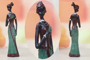 Detailed view of handcrafted African female sculptures with intricate ethnic patterns