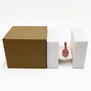 Pink flamingo ceramic jewelry tray with gold trim shown with its protective shipping box
