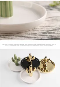 Detailed view of handmade ceramic cactus jewelry tray with gold plated finish and macro texture