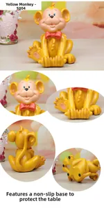 Detail view of monkey phone stand showing the resin texture and bottom anti-slip pads