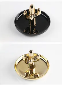 Macro detail of cactus ceramic jewelry trays in black and gold electroplated finish