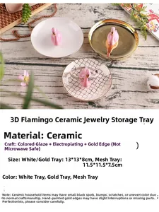 Close-up of golden ceramic swan jewelry tray with plated finish for ring storage