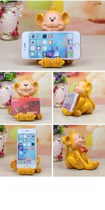 Detailed views of monkey resin phone holder used for smartphone and business cards