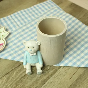 Cute cartoon bear pencil holder with wood grain texture for creative desk organization