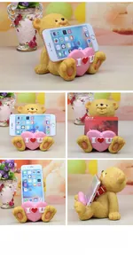 Detailed views of yellow teddy bear resin phone holder and business card stand for desk