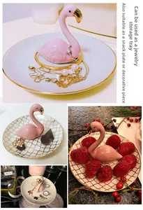 Detail of pink flamingo ceramic jewelry tray with golden rim and textured base