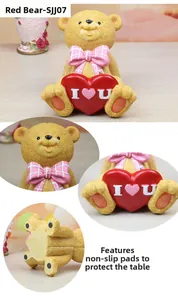 Detail view of teddy bear resin phone holder with I Love You heart and anti-slip base pads