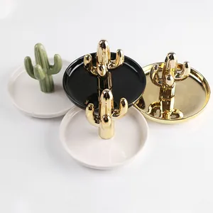 Ceramic cactus jewelry trays in gold, green, and black for rings and earrings