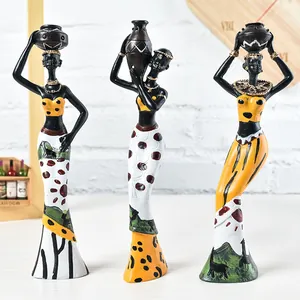 Three-piece set of African tribal women resin figurines with colorful patterned dresses