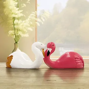 Elegant flamingo and swan figurine set on wooden desk for home decor and storage hook