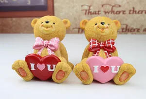 Macro shot of a pair of teddy bear resin figurines with heart-shaped I Love You details