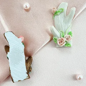 Faux tree branch wall hook with pink roses and green leaves for home wall decoration