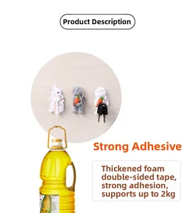 Cartoon rabbit wall hooks showing strong 2kg load capacity holding a heavy oil bottle
