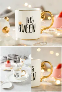 Detailed view of white ceramic mug with His Queen print, golden rim and designer handle