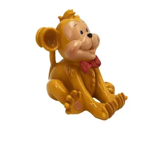 Golden monkey smartphone stand made of resin with red bowtie and stable phone holder slot