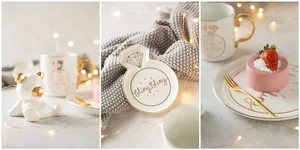 Detailed view of white ceramic mug with gold rim and diamond pattern in a lifestyle setting
