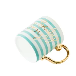 Nordic ceramic mug with mint green stripes, gold handle, and Baby Boy lettering