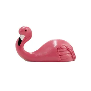 Pink flamingo resin figurine desktop ornament with detailed feather texture on white background