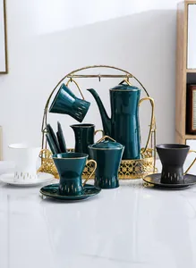 Luxurious ceramic tea and coffee set with gold trim and metal storage stand