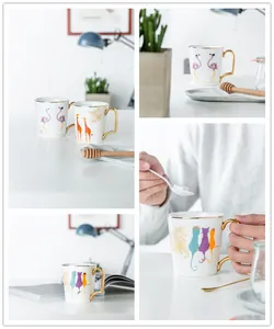 Dettaglio di tazze creative in ceramica con animali e manici dorati e bordi lucidi