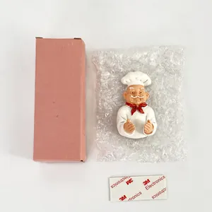 Detail view of cartoon chef toothbrush holder with 3M adhesive and packaging kit
