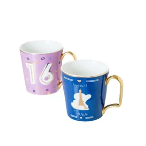 Set di tazze in ceramica con manici dorati, design numero 16 e Torre Eiffel