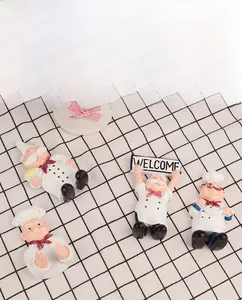 Set of four cute cartoon resin chef wall hooks in red and white for home kitchen decor