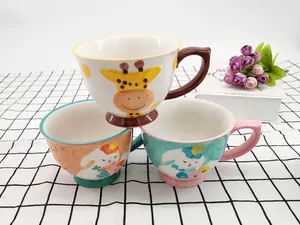 Detailed view of the 3D animal relief and crackle glaze texture on the ceramic mugs