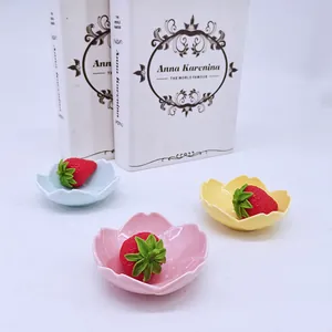 Cherry blossom shaped ceramic dipping sauce dishes in pink, yellow and blue colors