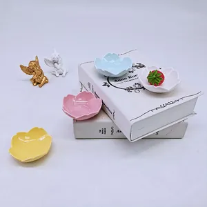 Floral ceramic seasoning dishes in petal shape with pastel colors for home kitchen use