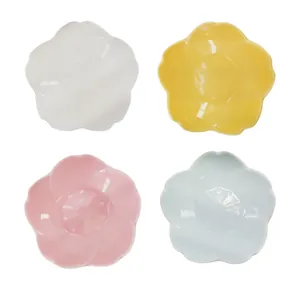 Petal-shaped ceramic dipping bowls set in white, yellow, pink, and sky blue glossy finish