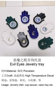 Dettaglio di vassoi per gioielli Mano di Fatima in ceramica con motivo Evil Eye
