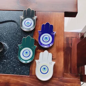 Set di quattro vassoi per gioielli Hamsa in ceramica con dettaglio Occhio del male e oro