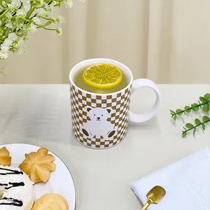 Retro checkered ceramic mug with cute bear pattern for morning coffee and breakfast
