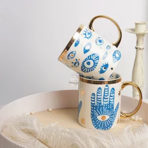 Tazze in ceramica con occhio di Allah e mano di Fatima con bordo e manico dorati