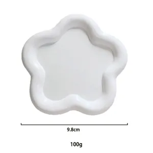 Detailed view of a white flower-shaped resin jewelry tray with 9.8cm diameter specifications