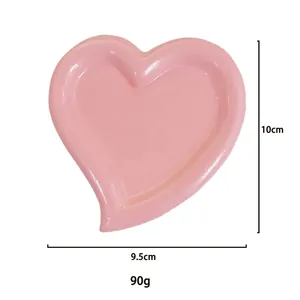 Pink heart-shaped resin jewelry tray for display with dimensions 10cm by 9.5cm