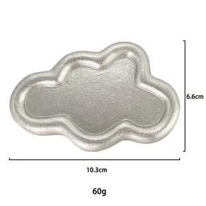 Macro view of matte silver cloud-shaped jewelry tray with dimensions 10.3cm x 6.6cm