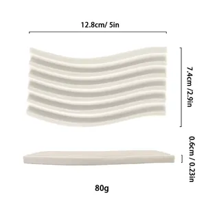Detailed view of white wavy resin jewelry tray with 12.8cm x 7.4cm size specifications