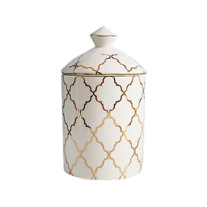 Modern white ceramic storage jar with gold clover pattern and pointed lid handle