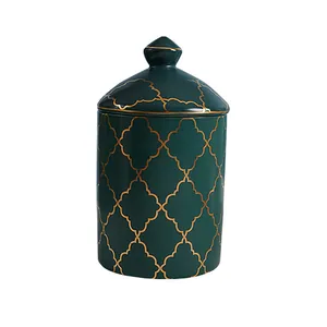 Luxurious dark green ceramic storage jar with golden geometric clover patterns and lid
