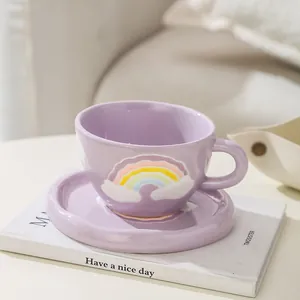 Hand-painted purple ceramic coffee cup and saucer set with 3D rainbow and clouds