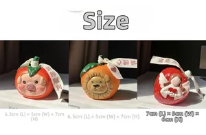 Detailed size view of cartoon resin figurines showing strawberry and persimmon ornaments