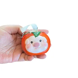 Handheld creative persimmon resin miniature ornament with a cute pig face design
