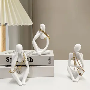 Three-piece set of golden abstract resin sculptures for creative office and home bookshelf decor