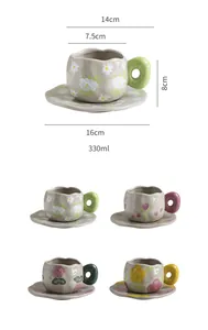 Detailed dimensions of hand-painted floral ceramic coffee mug and saucer set with donut handle