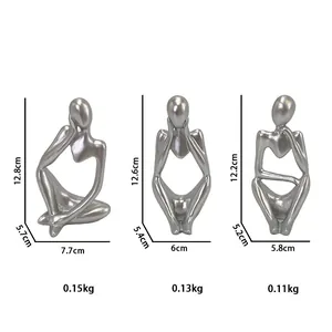 Three-piece silver resin abstract thinker sculptures with detailed size and weight labels